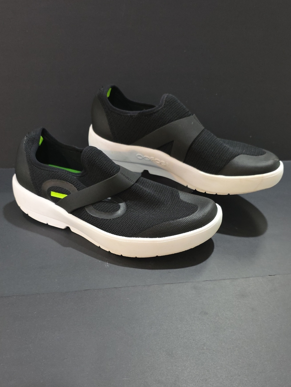 OOFOS Men's Slip-On Sneakers in Black with Neon Green Accents